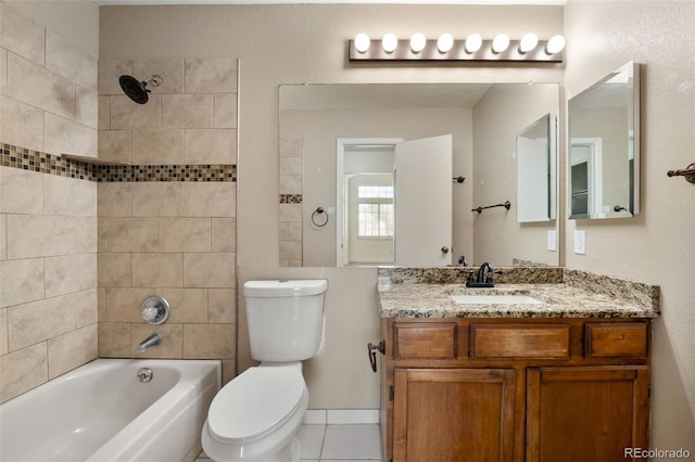 bathroom with toilet, tub / shower combination, and vanity