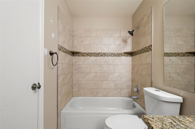 bathroom featuring toilet, washtub / shower combination, and vanity