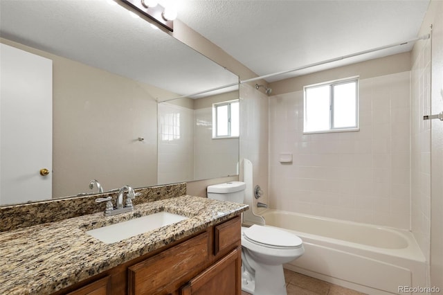 full bath with healthy amount of natural light, toilet, vanity, and shower / bathtub combination