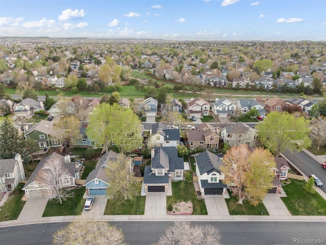 aerial view of property and surrounding area with nearby suburban area