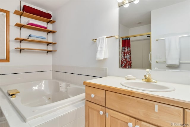 full bath featuring vanity and a jetted tub