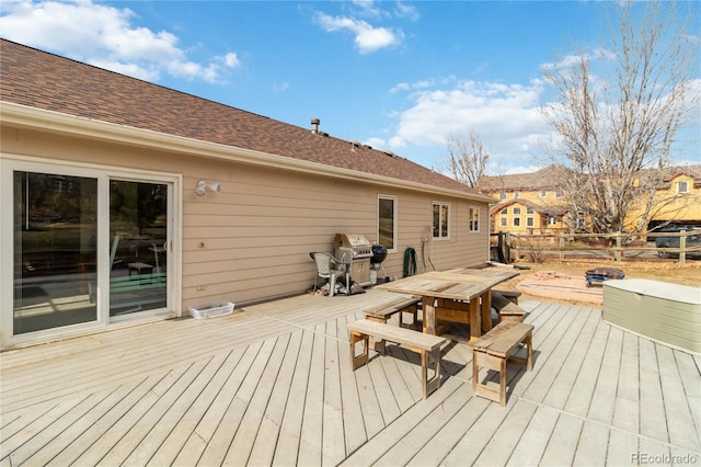 wooden deck featuring outdoor dining area and area for grilling