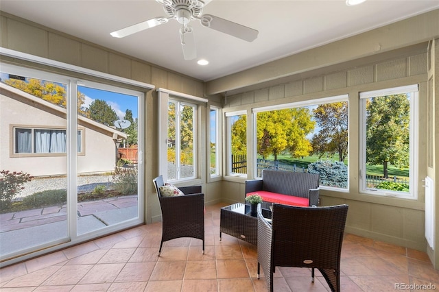 sunroom with ceiling fan