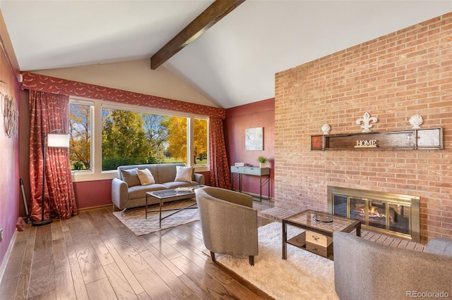 living room with wood-type flooring, a brick fireplace, and vaulted ceiling with beams