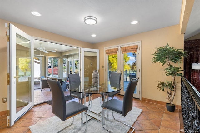 dining area featuring a wealth of natural light, french doors, tile patterned flooring, and ceiling fan