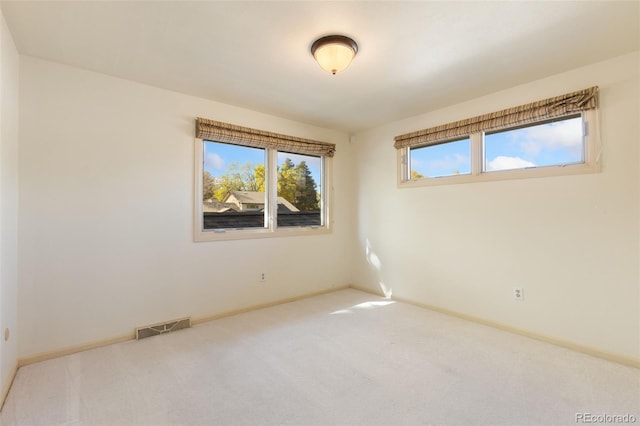 unfurnished room featuring carpet flooring