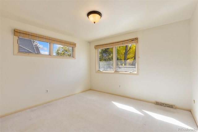 unfurnished room featuring carpet floors