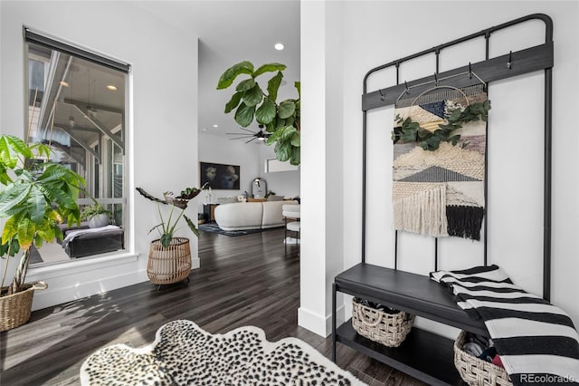 interior space featuring recessed lighting, baseboards, and wood finished floors