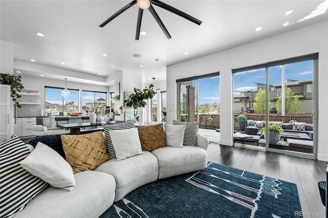 living room with recessed lighting, ceiling fan, and wood finished floors