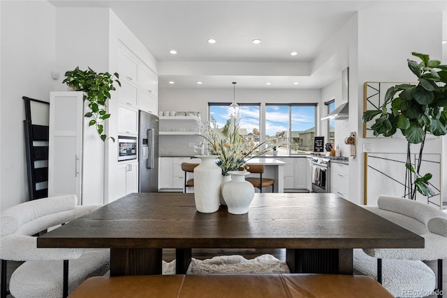 dining space featuring recessed lighting
