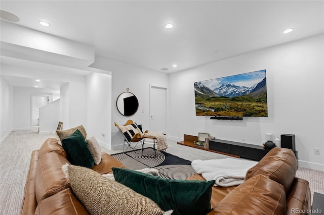 living area featuring recessed lighting, carpet flooring, baseboards, and stairway