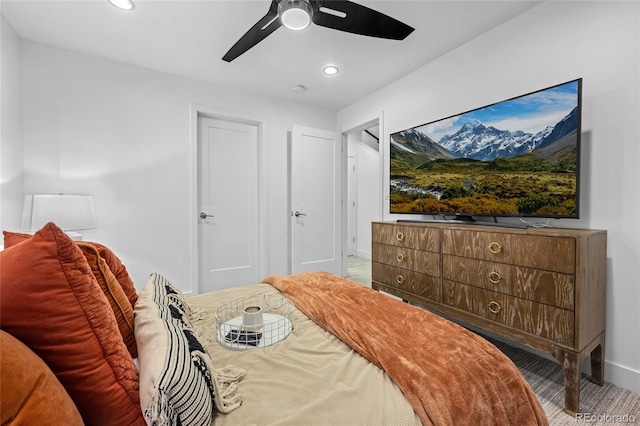 carpeted bedroom with baseboards, ceiling fan, and recessed lighting