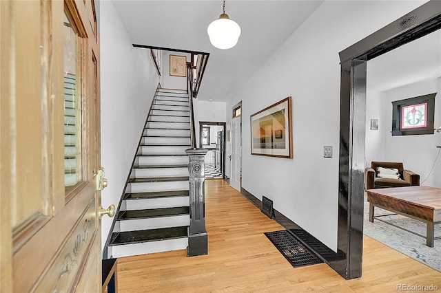 444 S Pearl St, Denver, CO 80209 - staircase featuring wood finished floors