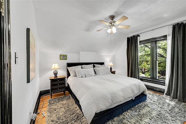 444 S Pearl St, Denver, CO 80209 - bedroom featuring lofted ceiling, a textured ceiling, ceiling fan, and light wood-style floors