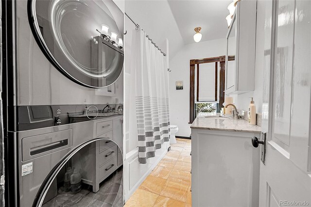 444 S Pearl St, Denver, CO 80209 - laundry room featuring stacked washing machine and dryer