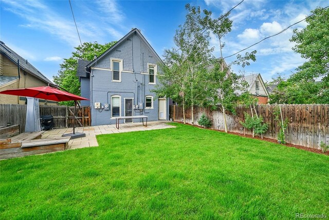 444 S Pearl St, Denver, CO 80209 - back of property with a fenced backyard, a patio area, and a wooden deck