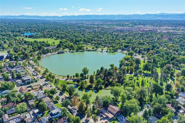 444 S Pearl St, Denver, CO 80209 - aerial view of property and surrounding area with a water and mountain view and a heavily wooded area