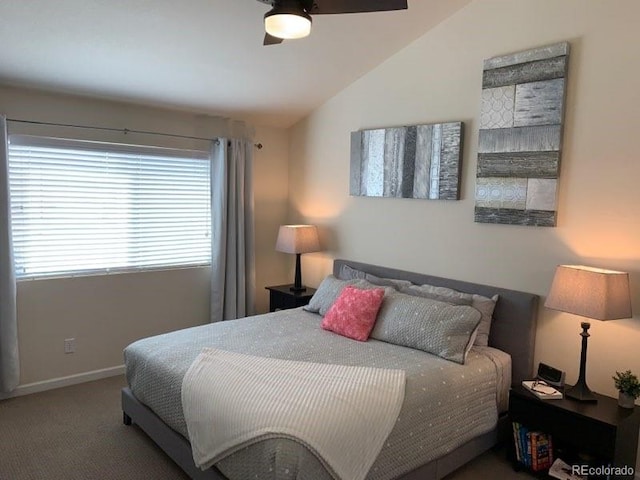 bedroom featuring ceiling fan, vaulted ceiling, and carpet flooring