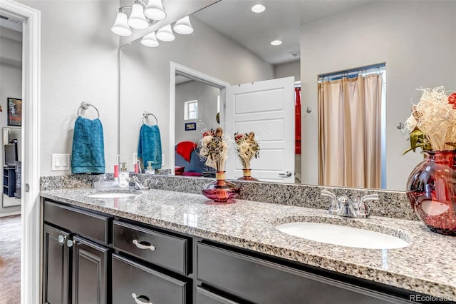 5519 Genoa St, Denver, CO 80249 - bathroom with double vanity and recessed lighting