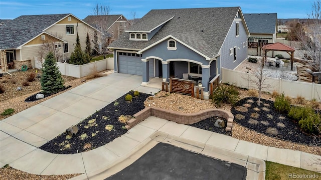 5519 Genoa St, Denver, CO 80249 - view of front of home with a shingled roof, driveway, a gazebo, and a garage