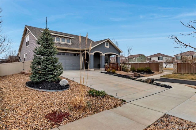 5519 Genoa St, Denver, CO 80249 - view of front facade with driveway, roof with shingles, a garage, a residential view, and a porch