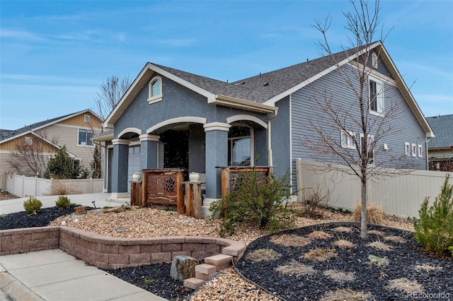 5519 Genoa St, Denver, CO 80249 - view of front of home with a porch, a shingled roof, stucco siding, and a garage