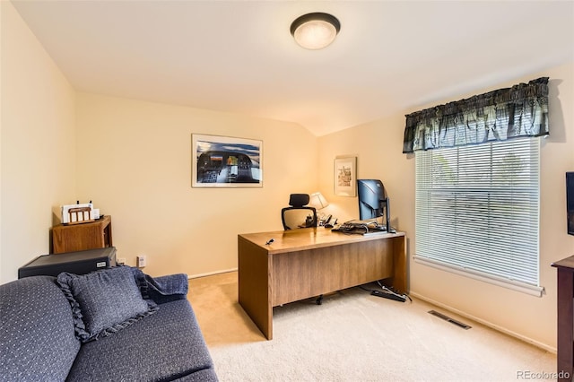 office featuring visible vents, baseboards, and light carpet