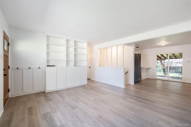 unfurnished room featuring light hardwood / wood-style flooring