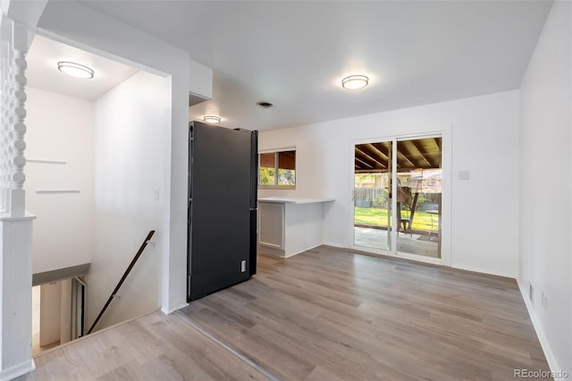 unfurnished room featuring light wood-type flooring