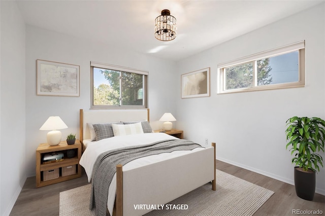 bedroom with wood-type flooring