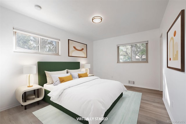 bedroom with light hardwood / wood-style flooring