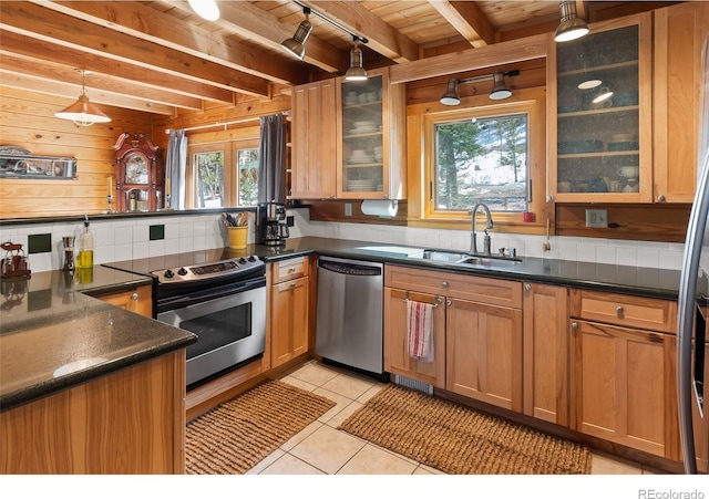 1666 High Creek Rd, Fairplay, CO 80440 - kitchen with appliances with stainless steel finishes, a sink, tasteful backsplash, dark countertops, and wooden ceiling with exposed beams