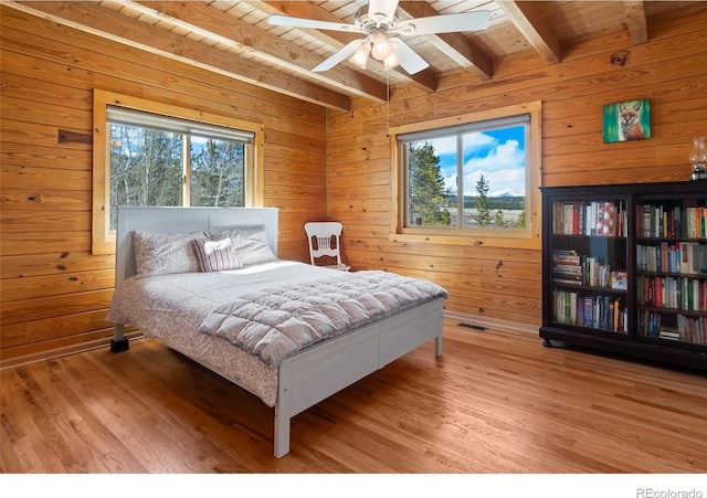 1666 High Creek Rd, Fairplay, CO 80440 - bedroom featuring wooden walls, wood finished floors, wood ceiling with exposed beams, and ceiling fan