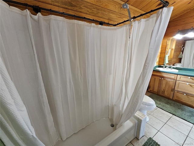 1666 High Creek Rd, Fairplay, CO 80440 - full bathroom featuring vanity, shower / tub combo, toilet, wood walls, and tile patterned floors
