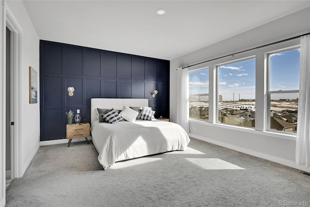 bedroom featuring light carpet