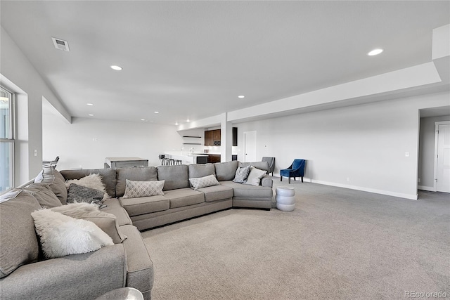 living room featuring light colored carpet