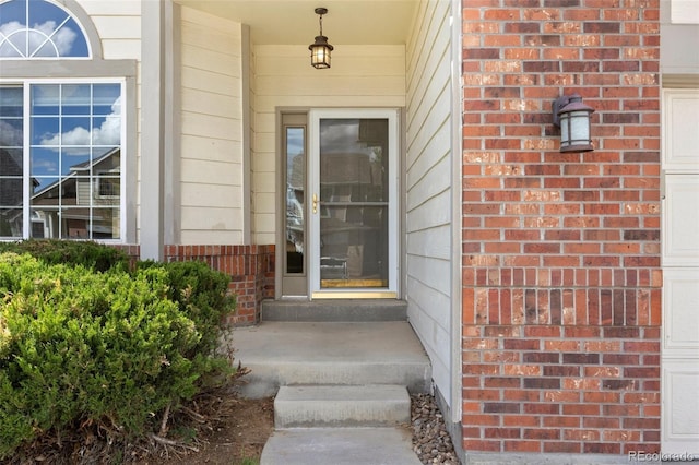 8985 Edgewood Ln, Highlands Ranch, CO 80130 - view of exterior entry featuring brick siding