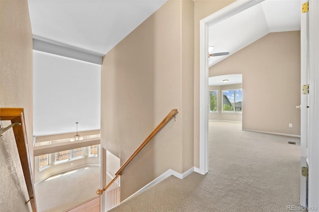 8985 Edgewood Ln, Highlands Ranch, CO 80130 - hallway with an upstairs landing, carpet, vaulted ceiling, and baseboards