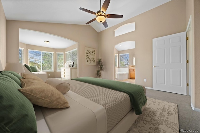 8985 Edgewood Ln, Highlands Ranch, CO 80130 - carpeted bedroom with vaulted ceiling, arched walkways, baseboards, ensuite bathroom, and ceiling fan