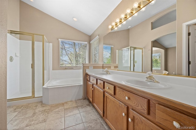 8985 Edgewood Ln, Highlands Ranch, CO 80130 - full bathroom featuring vaulted ceiling, a stall shower, a bath, and double vanity