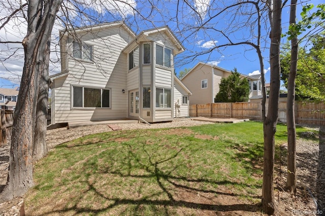 8985 Edgewood Ln, Highlands Ranch, CO 80130 - rear view of house featuring a patio