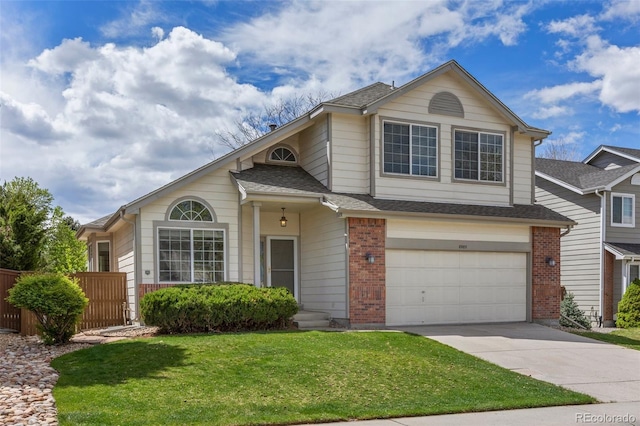 8985 Edgewood Ln, Highlands Ranch, CO 80130 - view of front of property featuring driveway, a garage, brick siding, and roof with shingles