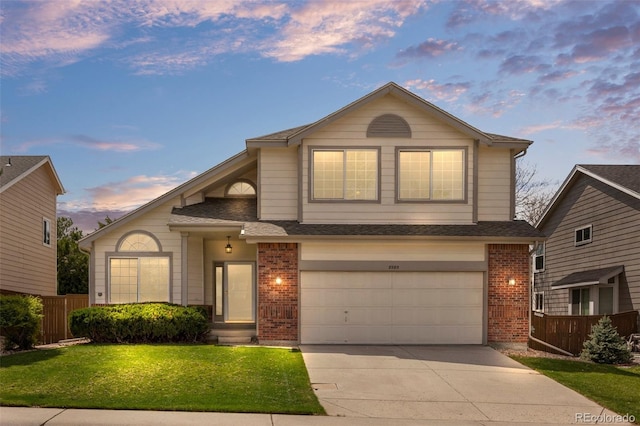 8985 Edgewood Ln, Highlands Ranch, CO 80130 - traditional-style house with brick siding, concrete driveway, and a garage