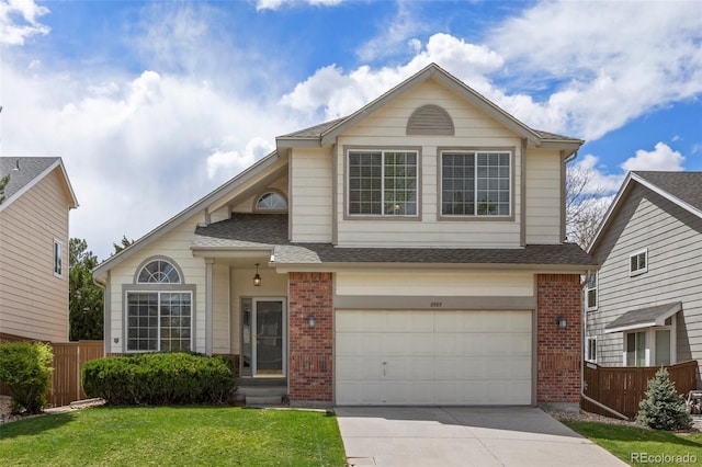 8985 Edgewood Ln, Highlands Ranch, CO 80130 - traditional-style house with brick siding, an attached garage, concrete driveway, and a shingled roof