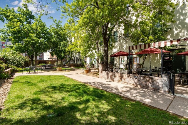 2193 Arapahoe St Unit 15, Denver, CO 80205 - view of grassy yard with a patio area