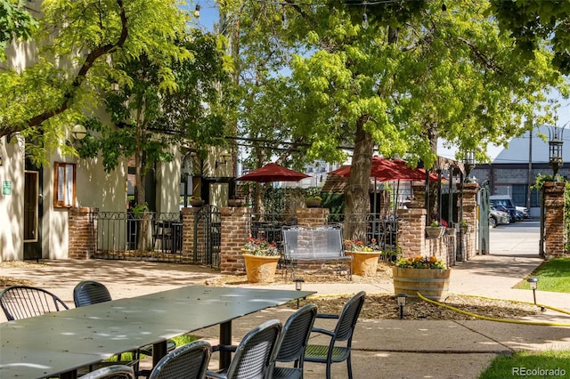 2193 Arapahoe St Unit 15, Denver, CO 80205 - view of property's community with fence and outdoor dining area