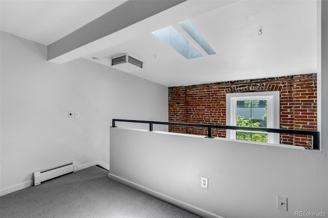 2193 Arapahoe St Unit 15, Denver, CO 80205 - carpeted spare room with a baseboard radiator, a skylight, and baseboards
