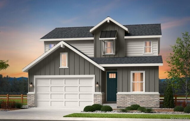 3343 N Catawba Way, Aurora, CO 80019 - view of front of house featuring a garage, fence, concrete driveway, board and batten siding, and roof with shingles