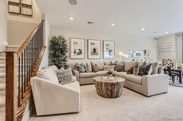 3343 N Catawba Way, Aurora, CO 80019 - living area featuring carpet flooring, stairway, visible vents, and recessed lighting