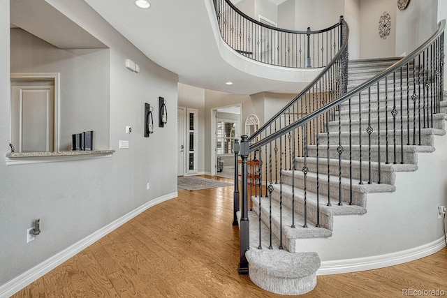 26566 E Peakview Dr, Aurora, CO 80016 - staircase featuring recessed lighting, baseboards, and wood finished floors